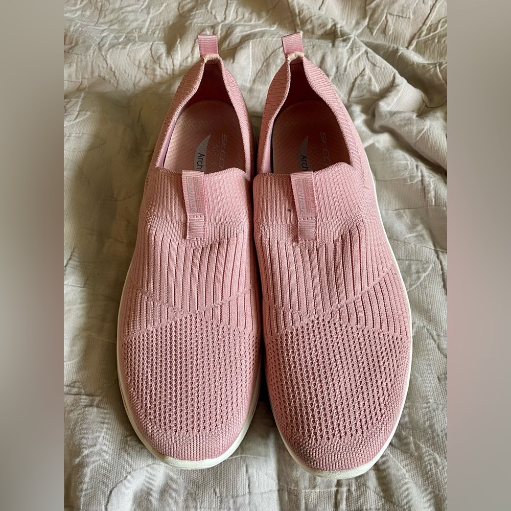 Pink Sketchers Archfit slip on shoes.